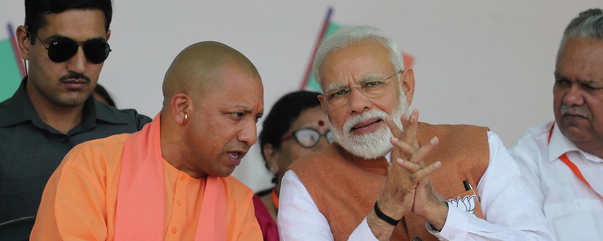 FILE- In this March 28, 2019, file photo, Indian Prime Minister Narendra Modi, right, speaks with Chief Minister of Uttar Pradesh state Yogi Adityanath during an election campaign rally in Meerut, India - Sputnik International, 1920, 26.10.2021