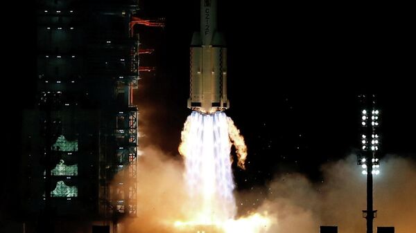 The Long March-2F Y13 rocket, carrying the Shenzhou-13 spacecraft and three astronauts in China's second crewed mission to build its own space station, launches at Jiuquan Satellite Launch Center near Jiuquan, Gansu province, China October 16, 2021. - Sputnik International