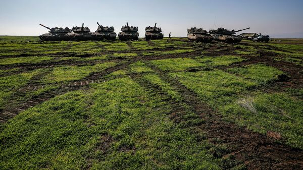 Israeli Merkava battle tanks hold position near Moshav Kidmat Tzvi in the Israeli-controlled Golan Heights on December 25, 2020 - Sputnik International