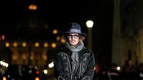 Actor Johnny Depp, backdropped by St. Peter's dome, poses on the red carpet before a masterclass at the 16th edition of the Rome Film Fest in Rome, Sunday, Oct. 17, 2021. - Sputnik International