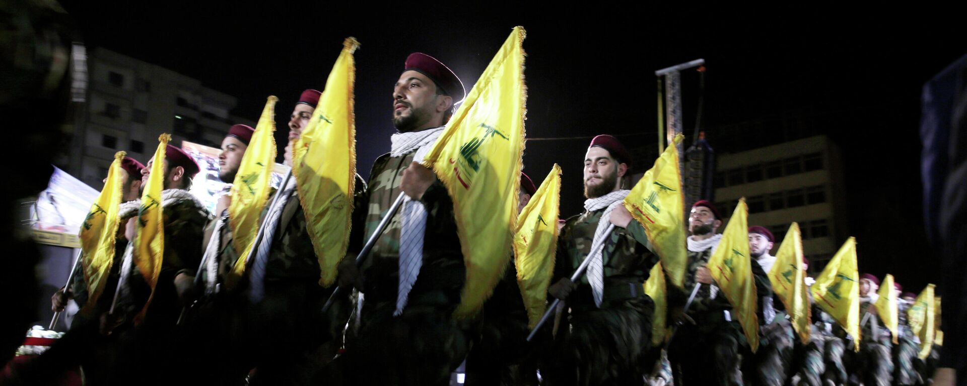  In this May 31, 2019 file photo, Hezbollah fighters march at a rally to mark Jerusalem day or Al-Quds day, in the southern Beirut suburb of Dahiyeh, Lebanon. On Monday, Oct. 18, 2021, Hezbollah leader Sheik Hassan Nasrallah revealed that his militant group has 100,000 trained fighters. - Sputnik International, 1920, 08.08.2024