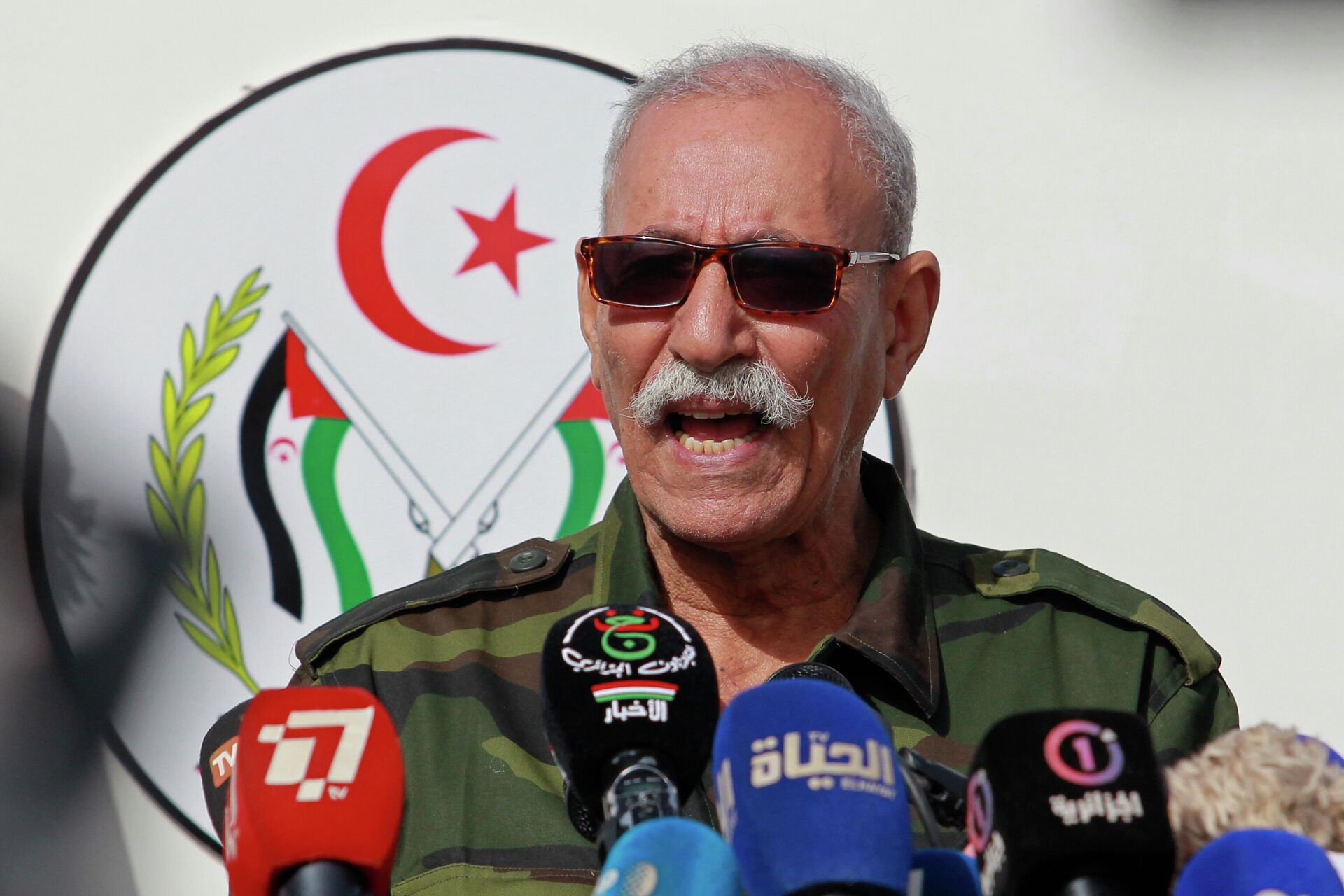In this Feb. 27, 2021 file photo, Brahim Ghali, leader of the Polisario front, delivers a speech in a refugee camp near Tindouf, southern Algeria. Brahim Ghali, the leader of the Western Sahara independence movement at the heart of a diplomatic spat between Spain and Morocco, will appear before an investigating judge in Spain on June 1, 2021. Ghali, who has been recovering from COVID-19 in a Spanish hospital, faces a probe for possible genocide and a lawsuit for alleged tortures. - Sputnik International, 1920, 18.10.2022