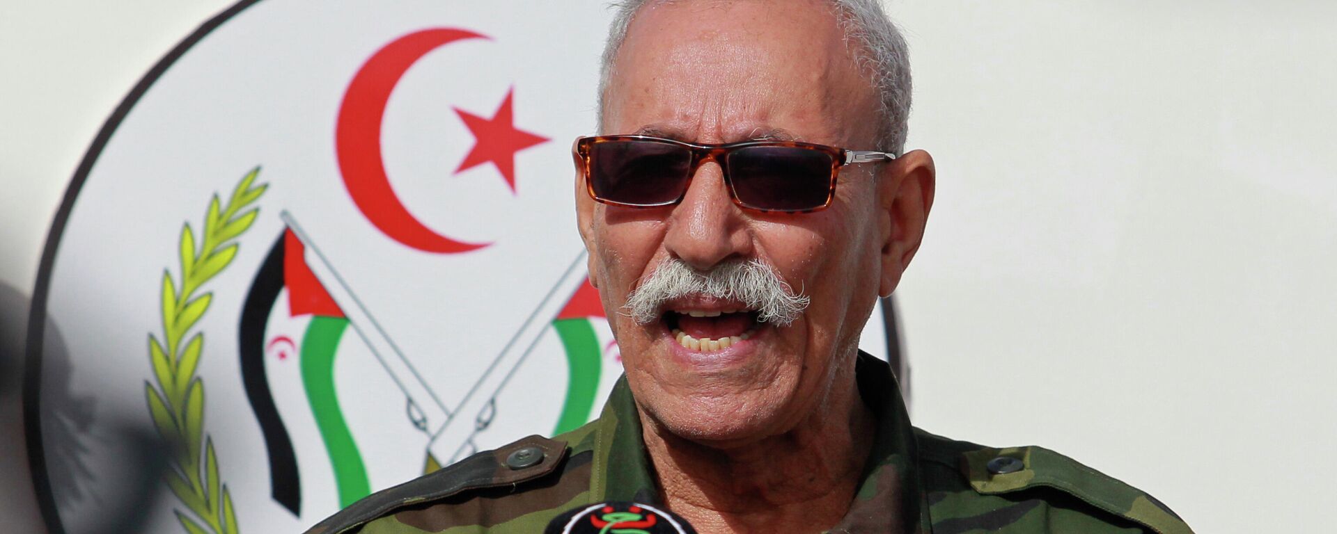 In this Feb. 27, 2021 file photo, Brahim Ghali, leader of the Polisario front, delivers a speech in a refugee camp near Tindouf, southern Algeria. Brahim Ghali, the leader of the Western Sahara independence movement at the heart of a diplomatic spat between Spain and Morocco, will appear before an investigating judge in Spain on June 1, 2021. Ghali, who has been recovering from COVID-19 in a Spanish hospital, faces a probe for possible genocide and a lawsuit for alleged tortures. - Sputnik International, 1920, 19.03.2022