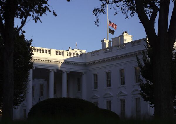 The American flag and National League of Families POW/MIA flag on top of the White House flying at half-staff following the death of former Secretary of State Colin Powell, on 18 October 2021 in Washington, DC. Powell, 84, died Monday due to complications from COVID-19. - Sputnik International