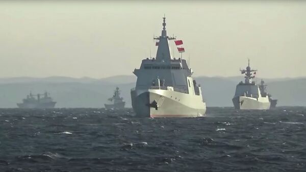 A group of naval vessels from China and Russia sails during joint military drills in the Sea of Japan, in this still image taken from video released on October 18, 2021. Video released October 18, 2021 - Sputnik International