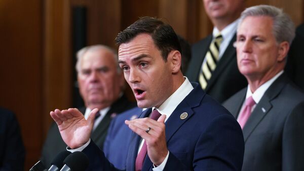 Rep. Mike Gallagher, R-Wis., a former Marine, joins House Minority Leader Kevin McCarthy, R-Calif., right, and other GOP members to criticize President Joe Biden and House Speaker Nancy Pelosi on the close of the war in Afghanistan, at the Capitol in Washington, Tuesday, Aug. 31, 2021. - Sputnik International