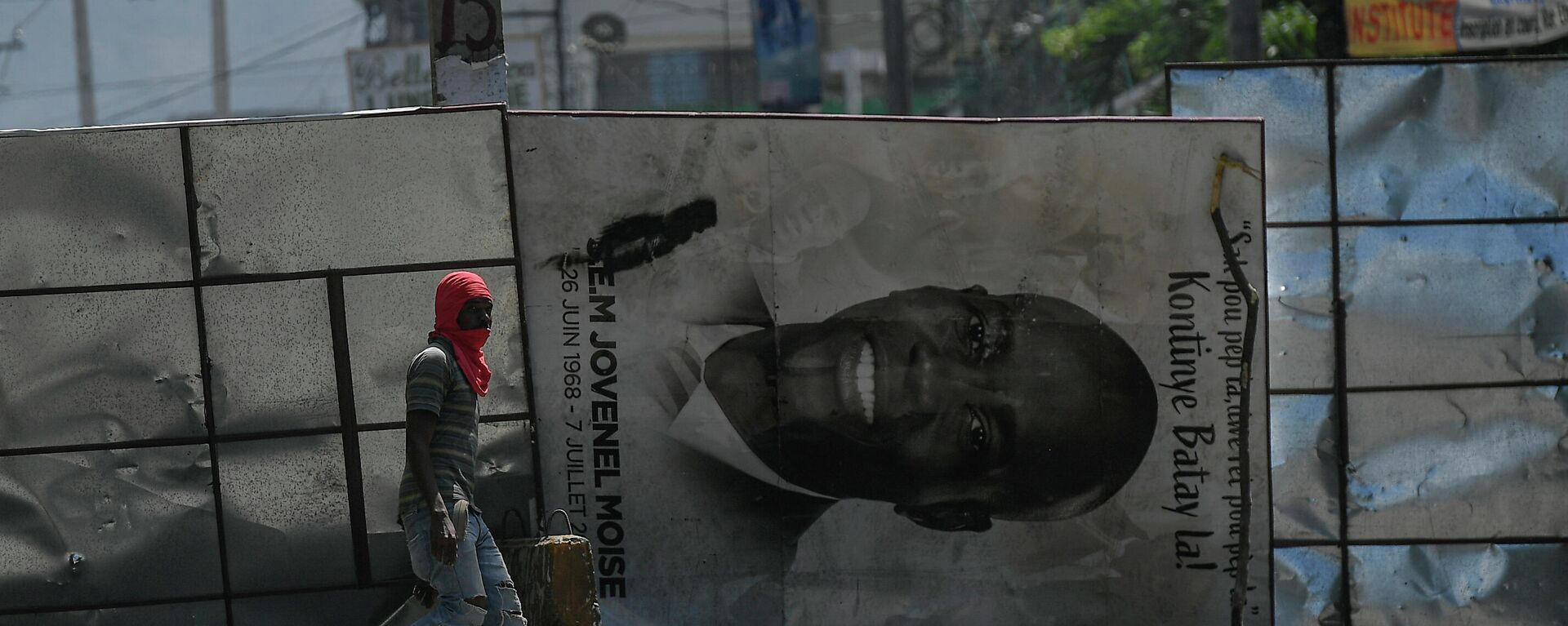 A billboard of slain Haitian President Jovenel Moise is used to block a road during an anti-government protest in Port-au-Prince, Haiti, Thursday, Oct. 21, 2021. - Sputnik International, 1920, 26.04.2022