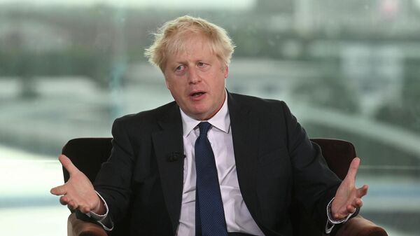 Britian's Prime Minister Boris Johnson appears as a guest on the Andrew Marr Show at the BBC Broadcasting House in London, Britain October 3, 2021 - Sputnik International