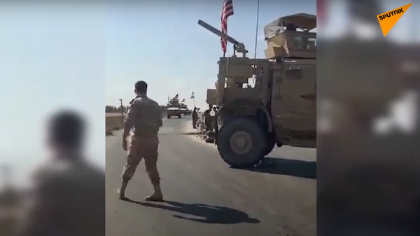 Syrian troops force US convoy to turn around in Hasakah province. Screengrab of Sputnik Arabic video. - Sputnik International