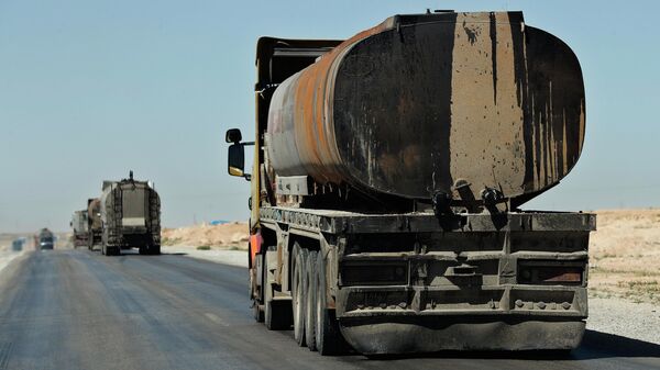 In this April 4, 2018 photo, a convoy of oil trucks moves fuel produced in Kurdish-held areas, in Hassakeh province, Syria. The U.S.-backed Syrian Democratic Forces defeated the Islamic state group in March but the Kurdish-led force is now facing protests by local Arab tribesmen in Deir el-Zour province - Sputnik International