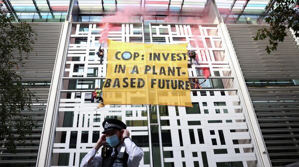 Animal Rebellion activists hang a banner from the side of the Home Office building, in London, Britain October 26, 2021 - Sputnik International