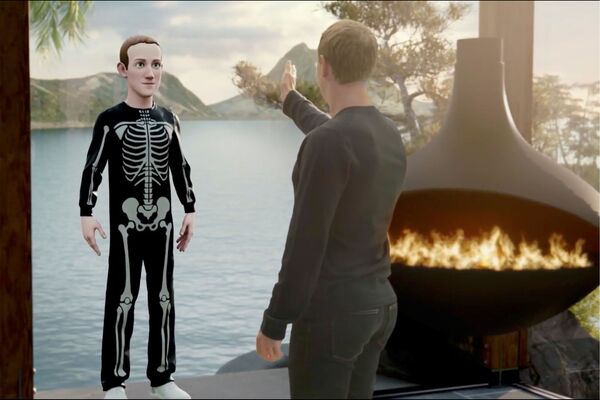 Facebook&#x27;s chief executive Mark Zuckerberg speaks to an avatar of himself in the &quot;Metaverse&quot; during a live-streamed virtual and augmented reality conference to announce the rebranding of Facebook. - Sputnik International