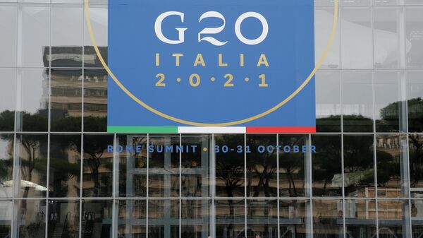 Workers clean in front of the Rome Convention Centre 'La Nuvola', in the city's EUR district, that will host the G20 summit with heads of state from major nations for a two-day meeting from October 30-31, in Rome, Italy, October 22, 2021.  - Sputnik International