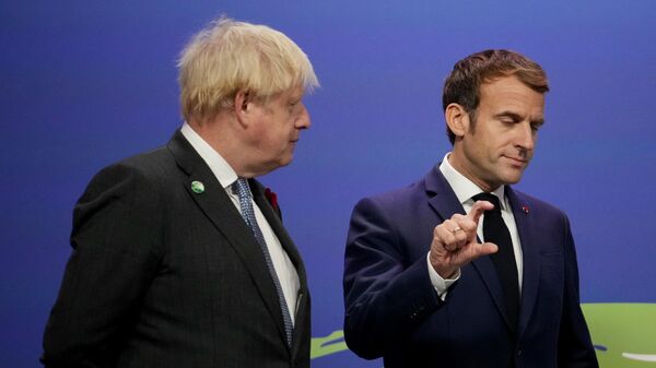 Britain's Prime Minister Boris Johnson greets French President Emmanuel Macron as he arrives to attend the COP26 UN Climate Change Conference in Glasgow, Scotland on November 1, 2021. - COP26, running from October 31 to November 12 in Glasgow will be the biggest climate conference since the 2015 Paris summit and is seen as crucial in setting worldwide emission targets to slow global warming, as well as firming up other key commitments. (Photo by Christopher Furlong / POOL / AFP) - Sputnik International