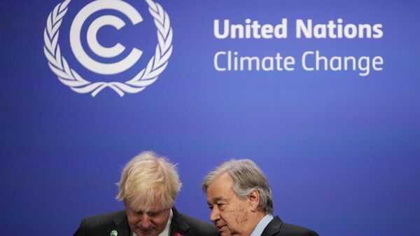 Britain's Prime Minister Boris Johnson (L) talks with United Nations (UN) Secretary General Antonio Guterres as they wait to greet leaders at the COP26 UN Climate Change Conference in Glasgow, Scotland on November 1, 2021. - Sputnik International