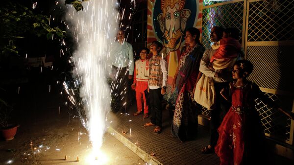 People play with fireworks during Diwali, the festival of lights, in Prayagraj, India, Sunday, Oct. 27, 2019 - Sputnik International