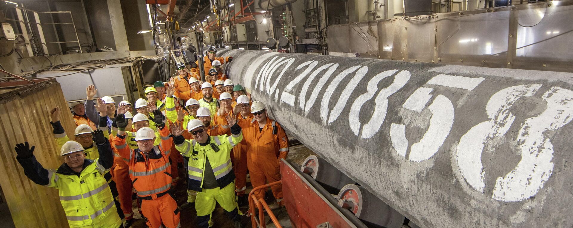 Specialists pose for a picture after welding the last pipe of the Nord Stream 2 gas subsea pipeline onboard the laybarge Fortuna in German waters in the Baltic Sea, September 6, 2021 - Sputnik International, 1920, 19.11.2021