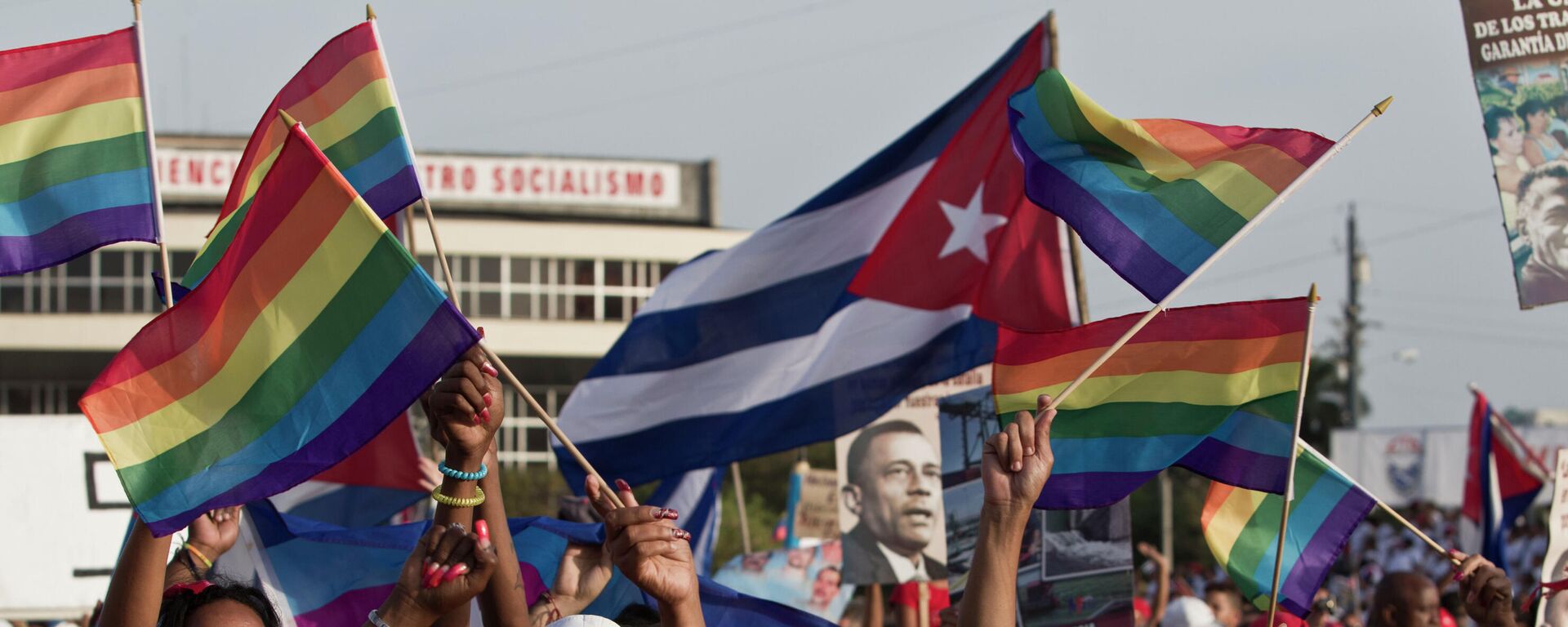 LGBT community members march waving representations of Cuba's national flag and rainbow flags during May Day march in Havana, Cuba, Thursday, May 1, 2014. Cuba marks each May Day not with protests but with massive marches organized by workplaces, schools and government. Thousands of islanders filed through Havana's Revolution Plaza on Thursday to a soundtrack of congas, drums and cries of Long live the revolution!  - Sputnik International, 1920, 22.07.2022