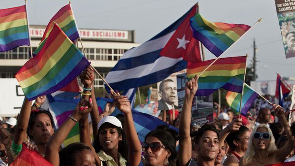 LGBT community members march waving representations of Cuba's national flag and rainbow flags during May Day march in Havana, Cuba, Thursday, May 1, 2014. Cuba marks each May Day not with protests but with massive marches organized by workplaces, schools and government. Thousands of islanders filed through Havana's Revolution Plaza on Thursday to a soundtrack of congas, drums and cries of Long live the revolution!  - Sputnik International