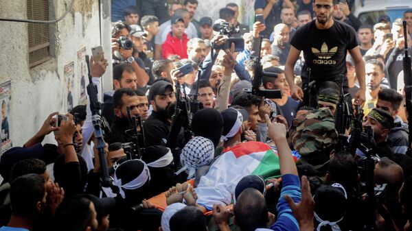 Mourners carry the body of Palestinian boy Mohamed Dadis, who the Palestinian health ministry said was killed by Israeli forces during clashes, in Nablus, in the Israeli-occupied West Bank November 6, 2021 - Sputnik International