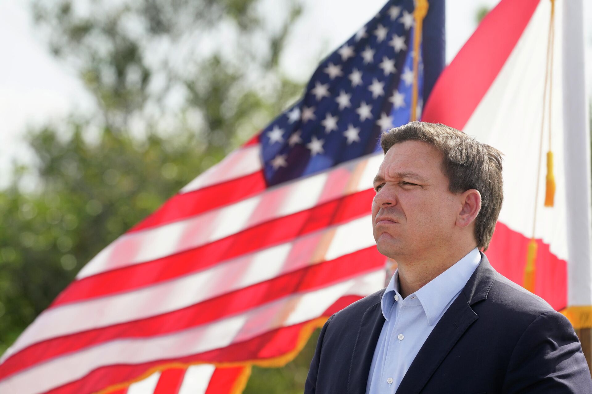Florida Gov. Ron DeSantis listens during a news conference, Tuesday, Aug. 3, 2021, near the Shark Valley Visitor Center in Miami - Sputnik International, 1920, 27.10.2022