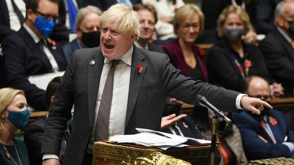 A handout photograph released by the UK Parliament shows Britain's Prime Minister Boris Johnson speaking during Prime Minister's Questions (PMQs) at the House of Commons, in central London on November 3, 2021  - Sputnik International