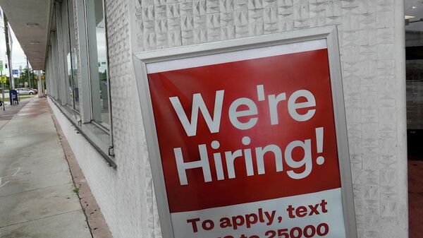 A ' We're Hiring sign hangs near the entrance to a CVS store on November 05, 2021 in Miami Beach, Florida. The Labor Department reported today that the U.S. job market in October showed that non-farm payrolls rose more than expected and that the unemployment rate fell to 4.6% - Sputnik International