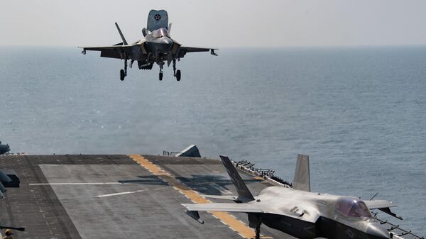 F-35B Lightning II attached to Marine Fighter Attack Squadron (VMFA) 211, deployed with the British Royal Navy aircraft carrier HMS Queen Elizabeth, lands on the flight deck of the amphibious assault ship USS Essex (LHD 2) during an interoperability exercise with Queen Elizabeth, Nov. 8. Essex and the 11th Marine Expeditionary Unit are deployed to the U.S. 5th Fleet area of operations in support of naval operations to ensure maritime stability and security in the Central Region, connecting the Mediterranean and the Pacific through the western Indian Ocean and three strategic choke points. - Sputnik International