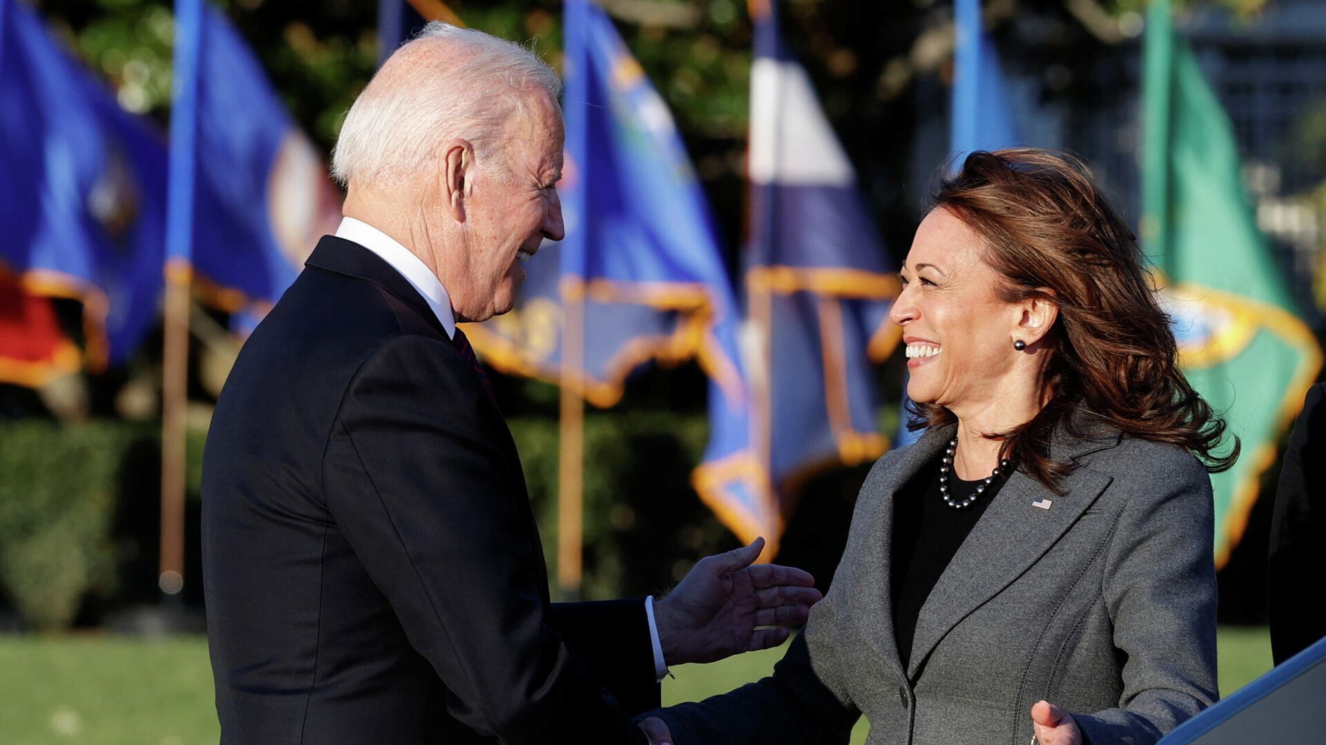 U.S. President Joe Biden and Vice-President Kamala Harris shake hands during a ceremony to sign the Infrastructure Investment and Jobs Act, on the South Lawn at the White House in Washington, U.S., November 15, 2021 - Sputnik International, 1920, 22.03.2022