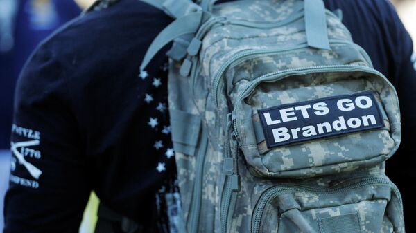 A demonstrator has a Lets Go Brandon patch on his backpack at a Rise Against Tyranny event led by Super Happy Fun America, which describes itself as a right of center civil rights organization, in Boston, Massachusetts, U.S., November 7, 2021 - Sputnik International