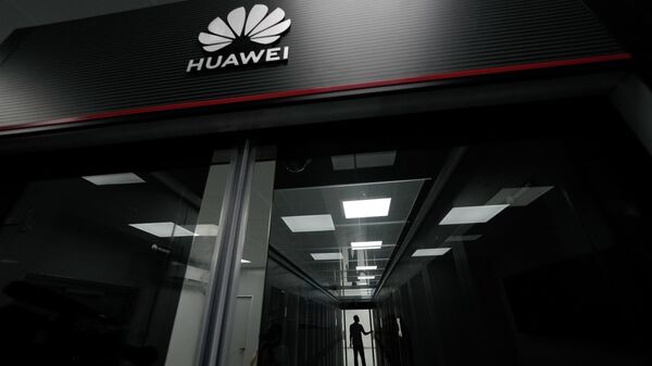 A technician stands at the entrance to a Huawei 5G data center at the Guangdong Second Provincial General Hospital in Guangzhou, in southern China's Guangdong province, Sunday, Sept. 26, 2021 - Sputnik International