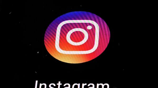 In this Nov. 29, 2018, file photo, the Instagram app logo is displayed on a mobile screen in Los Angeles. Political adversaries in Congress are united in outrage against Facebook for privately compiling information that its Instagram photo-sharing service appeared to grievously harm some teens, especially girls, while publicly downplaying the popular platform’s negative impact. - Sputnik International