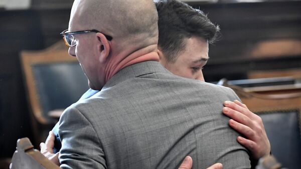 Kyle Rittenhouse hugs one of his attorneys Corey Chirafisi as he reacts to the verdict during his trial at the Kenosha County Courthouse in Kenosha, Wisconsin, U.S., November 19, 2021 - Sputnik International