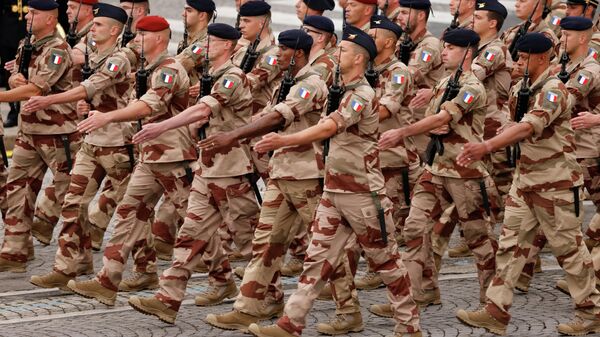 French Army soldiers from the 'Operation Barkhane' march during the annual Bastille Day military parade on the Champs-Elysees avenue in Paris on July 14, 2021 - Sputnik International