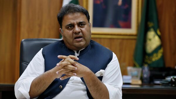 Pakistan's Information Minister Fawad Chaudhry speaks about violence against women during an interview with The Associated Press, in Islamabad, Pakistan, Tuesday, July 27, 2021 - Sputnik International