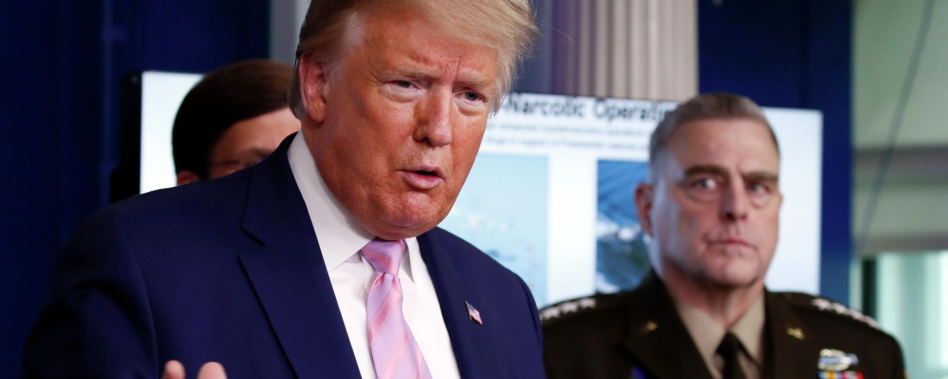 President Donald Trump speaks about the coronavirus in the James Brady Press Briefing Room of the White House, Wednesday, April 1, 2020, in Washington, as Chairman of the Joint Chiefs Gen. Mark Milley, listens. - Sputnik International, 1920, 13.06.2023
