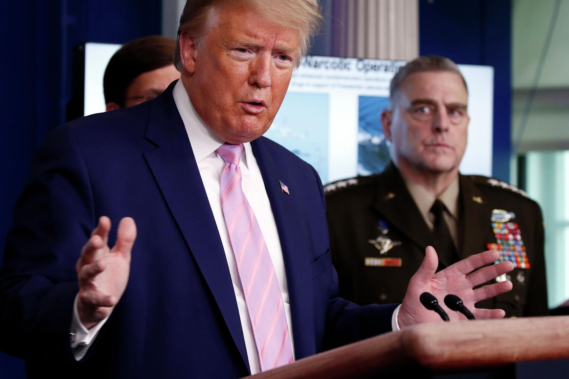 President Donald Trump speaks about the coronavirus in the James Brady Press Briefing Room of the White House, Wednesday, April 1, 2020, in Washington, as Chairman of the Joint Chiefs Gen. Mark Milley, listens. - Sputnik International, 1920, 06.12.2021