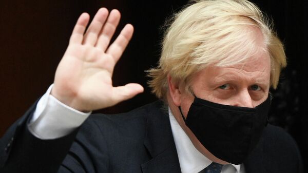 Britain's PM Johnson walks outside Downing Street in London - Sputnik International