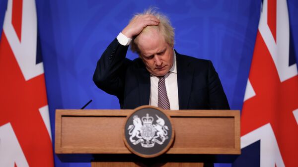 Britain's Prime Minister Boris Johnson gestures as he speaks during a press conference in London, Saturday Nov. 27, 2021, after cases of the new COVID-19 variant were confirmed in the UK - Sputnik International