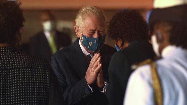 Britain's Prince Charles speaks with Barbados President-elect Sandra Mason as he arrives at Grantley Adams Airport to take part in events to mark the Caribbean island's transition to a birth of a new republic, Bridgetown, Barbados, November 28, 2021. Picture taken November 28, 2021 - Sputnik International
