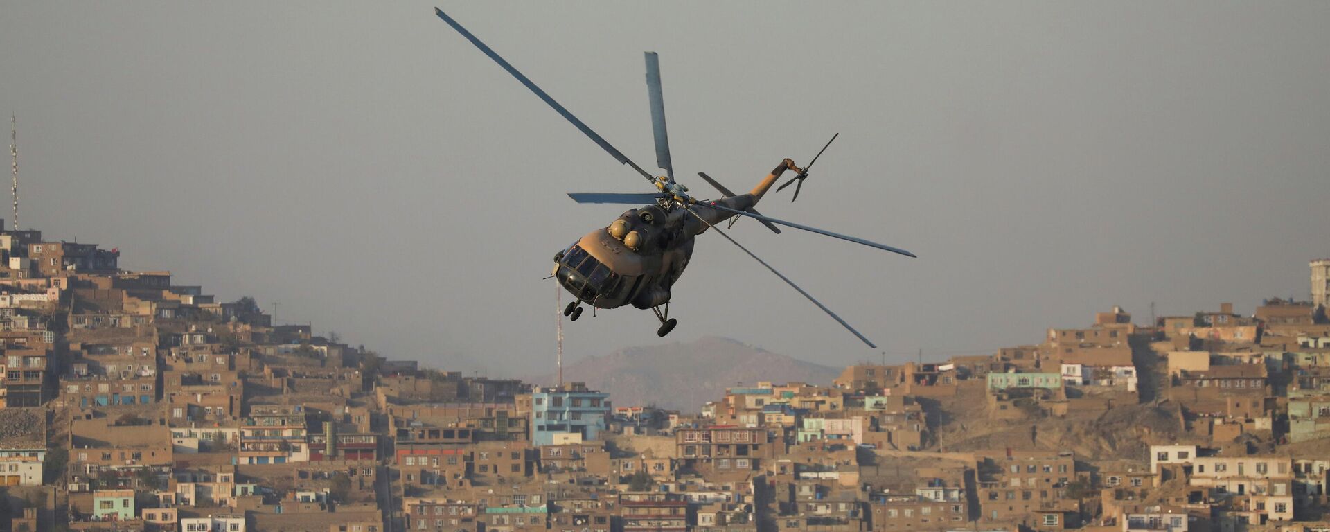 A military helicopter is pictured during the Taliban military parade in Kabul, Afghanistan November 14, 2021. - Sputnik International, 1920, 23.12.2021