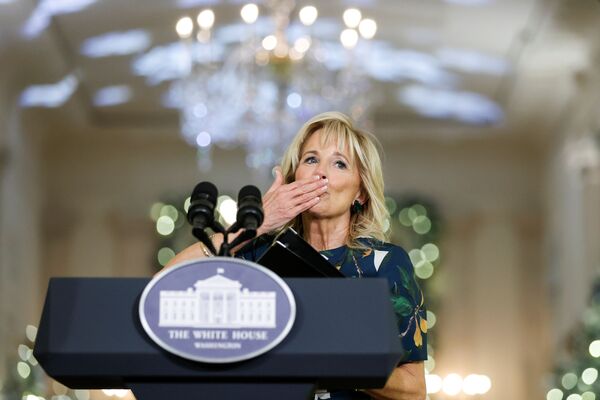 US first lady Jill Biden blows a kiss after meeting a room of volunteer decorators who helped to prepare the Christmas decorations at the White House in Washington, DC, 29 November 2021. - Sputnik International