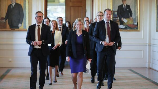 Sweden's Prime Minister Magdalena Andersson walks with her team of new ministers to attend a news conference after the government declaration in the Swedish parliament Riksdagen, in Stockholm, Sweden November 30, 2021. - Sputnik International