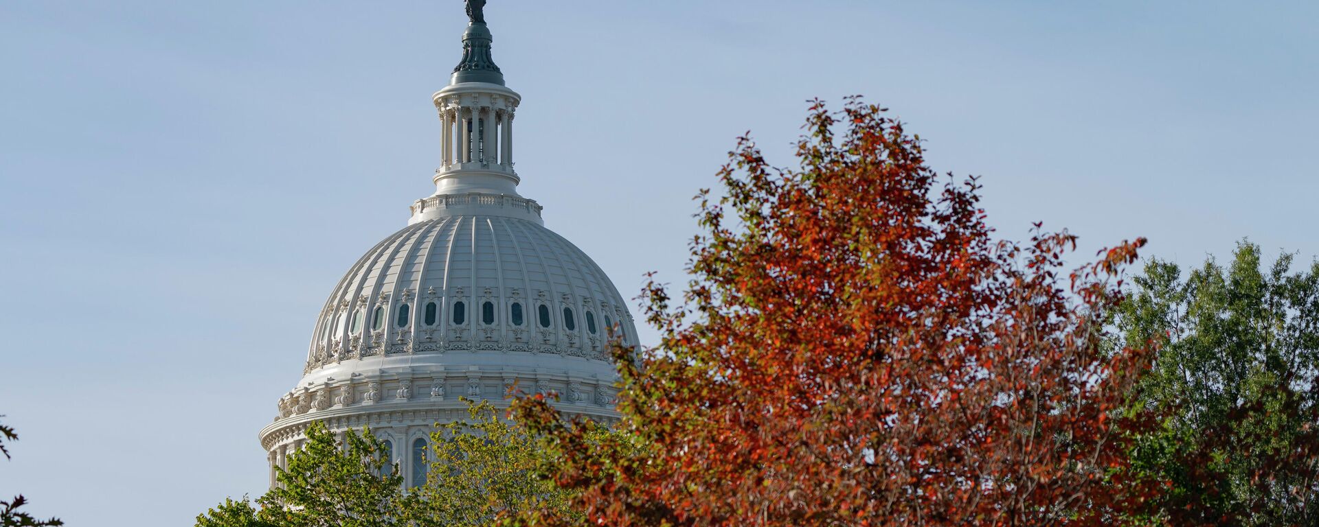 The U.S. Capitol is seen past fall foliage, Thursday, Oct. 28, 2021, on Capitol Hill in Washington. - Sputnik International, 1920, 12.08.2022