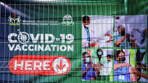 A banner is displayed on a fence at a coronavirus disease (COVID-19) vaccination centre, after the government commenced the roll out of mass vaccination in Abuja, Nigeria November 19, 2021.  - Sputnik International