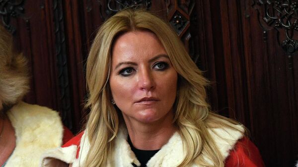 Baroness Michelle Mone (C) waits for the start of the State Opening of Parliament in the Houses of Parliament in London on June 21, 2017 - Sputnik International