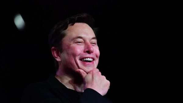  In this file photo taken on March 14, 2019 Tesla CEO Elon Musk reacts during the unveiling of the new Tesla Model Y in Hawthorne, California. - Sputnik International