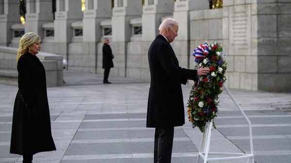 US President Joe Biden and First Lady Jill Biden place a wreath at the World War II Memorial to mark National Pearl Harbor Remembrance Day in Washington, DC, on December 7, 2021. - Sputnik International