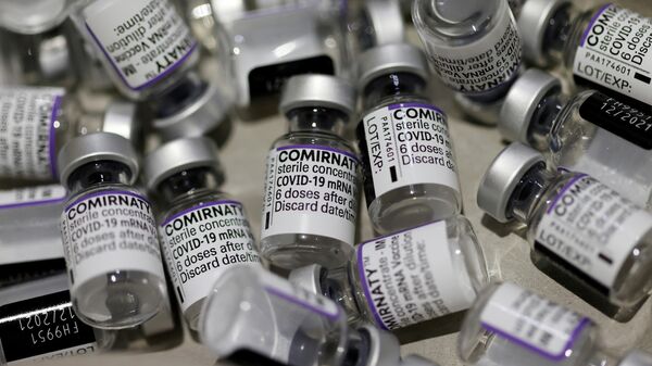 Empty vials of the Comirnaty Pfizer-BioNTech COVID-19 vaccine are seen at a coronavirus disease (COVID-19) vaccination center in Nice, France, November 23, 2021. - Sputnik International
