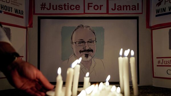 FILE PHOTO: The Committee to Protect Journalists and other press freedom activists hold a candlelight vigil in front of the Saudi Embassy to mark the anniversary of the killing of journalist Jamal Khashoggi at the kingdom's consulate in Istanbul, in Washington, U.S., October 2, 2019 - Sputnik International
